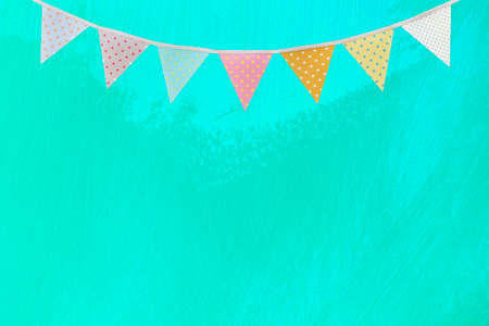 Flag garland on abstract blurred light blue wall texture background, blank artistic wall pattern backgroundの写真素材