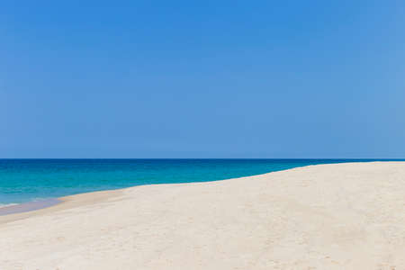 Fine sandy beach with clear blue sky background, tropical island beach in south of Thailand,...