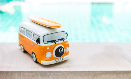 Ceramic beach bus on swimming pool edge, tropical summer holiday tripの写真素材