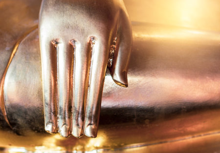 Closeup Lord buddha hand, Asian culture, symbol of peace and meditationの写真素材