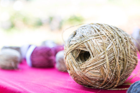 Hemp fiber roll over blurred background, nature fiber product of Thailandの写真素材