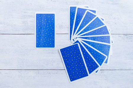 Tarot card display on white wood background, pick a card, fortune tellingの写真素材