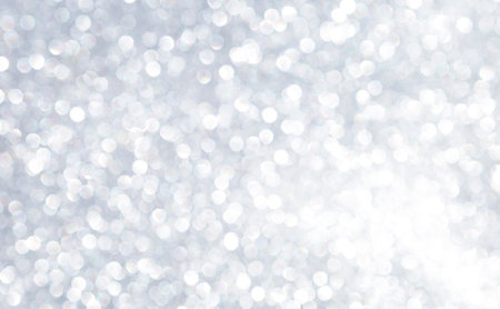 Abstract blurred shiny silver bokeh background, white bokeh on grey backgroundの写真素材