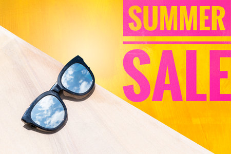 Sunglasses with summer sale banner, business conceptの写真素材