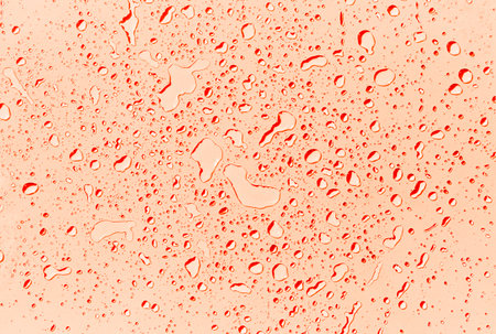 Abstract water drops on orange background, orange water drops pattern background