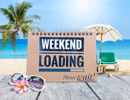 Weekend loading please wait on brown calendar over tropical beach, greeting card background ideaの写真素材