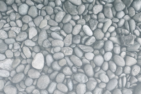 Natural grey stone background, Grey pebble stone backgroundの写真素材