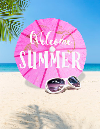 Welcome summer sign on pink paper umbrella with fashion sunglasses on tropical beach, summer season concept, outdoor day lightの写真素材