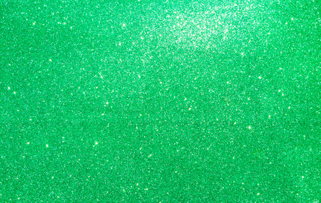 Abstract shiny green glitter texture background, green glitter pattern backgroundの写真素材