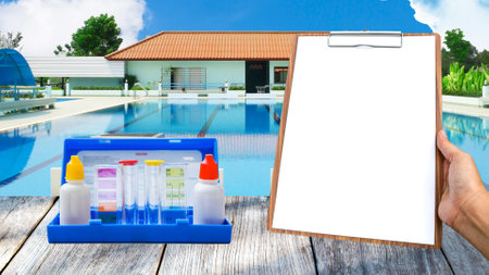 Swimming pool water testing test kit with blank report paper on wooden clipboard over swimming pool background, quality water tester, outdoor day lightの写真素材