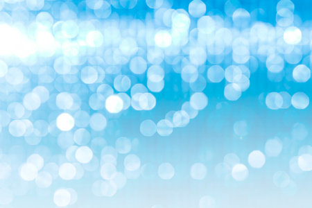 Abstract blurred blue light bokeh background, festive season concept background, blue bokeh pattern backgroundの写真素材