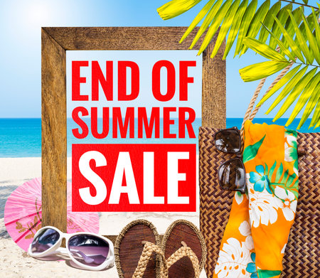 End of summer sale banner on wooden frame with summer accessories over tropical beach background, summer season promotion poster background ideaの写真素材