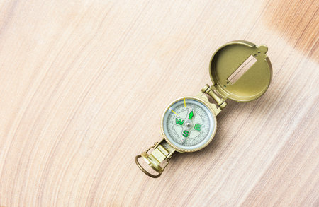 Compass on sandstone background, Navigation tool for tourism and direction of travel