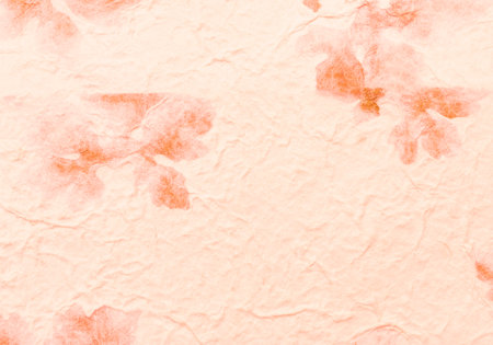 Orange paper with dry leaves pattern background, blank orange paper texture backgroundの写真素材