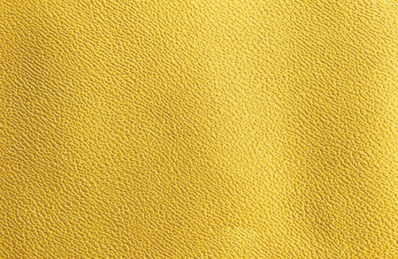 Closeup yellow leather texture background, empty yellow leather pattern backgroundの写真素材
