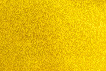 Yellow leather texture background, blank yellow leather pattern backgroundの写真素材