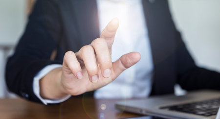 Business girl hand pointing finger, giving virtual touchscreen command, business concept background