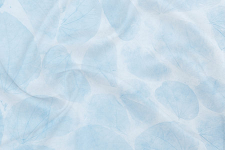 Abstract waving fabric with blue leaves pattern background, blank fabric with natural leaves texture...