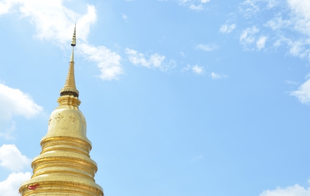 Golden Chedi with blue sky, Wat Prathat haripunchaiの写真素材