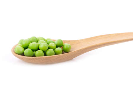 Green peas  in wooden spoon isolated on white background.Is a food of antioxidants.の写真素材