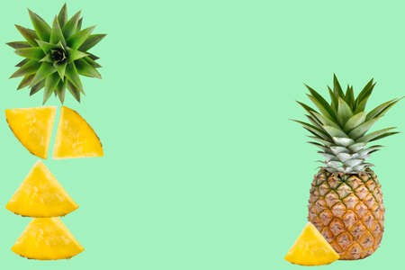 pineapple and  slice fruit ;head  isolated on green  background.の写真素材