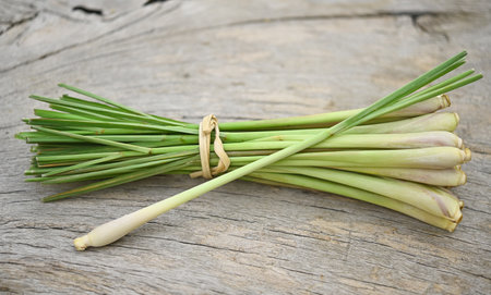 Fresh lemongrass on wooden texture in cooking concept and herbal food.の写真素材