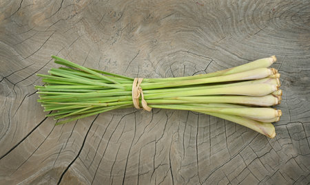 Fresh lemongrass on wooden texture in cooking concept and herbal food.の写真素材