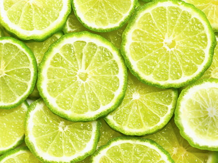 Fresh kaffir lime or bergamot herb fruit slice background.の写真素材
