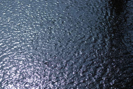 small water waves and reflectionの写真素材