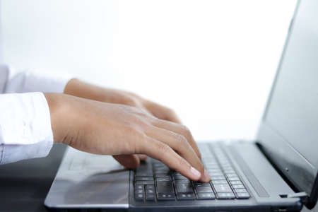 close up hand of Businessman typing on keyboard or laptop