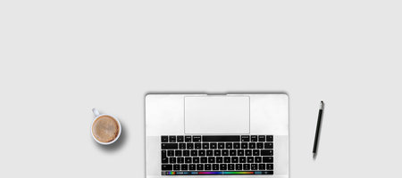 Laptop and coffee cup on white background. Top view. Flat layの写真素材