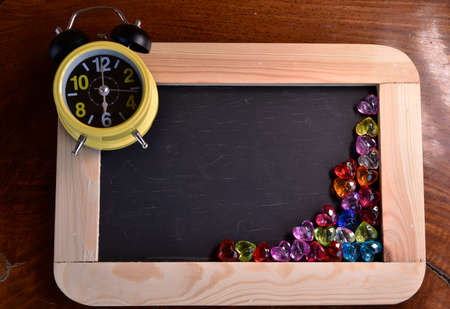 Vintage slate chalk board on wooden background