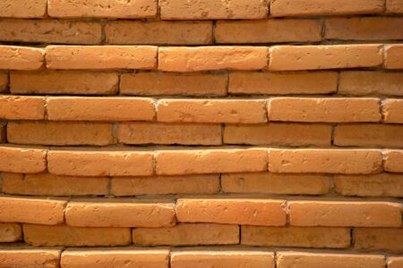 blurry brick wall background under tungsten light