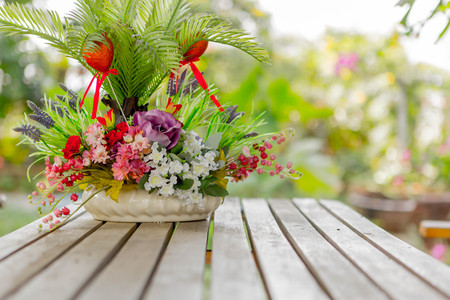 Vintage Filter : Plastic Flower Basket on woodの写真素材