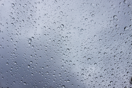 Drops of rain on glass , rain drops on clear windowの写真素材