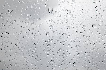 Drops of rain on glass , rain drops on clear windowの写真素材
