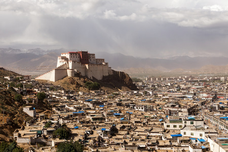 View of the outstanding Shigatse Dzong fortress on the hilltop,Tibet,in a cloudy dayのeditorial素材