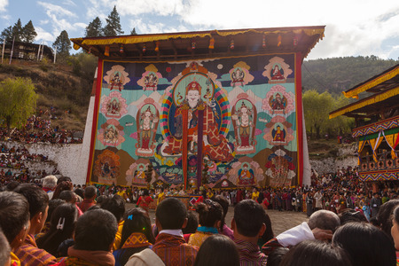 Paro,Bhutan-Apr 4,2015;Thongdroel(liberation on sight) of Guru Rinpoche hanging in Rinpung Dzong(fortress) during Paro Tshechu(festival) in order to confer blessings on Bhutanese assembled.のeditorial素材