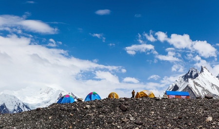 Beautiful tents on horizontal with blue sky and snow mountain at Concordia camp site on the way to K2 base camp,Skardu,Gilgit,Pakistanの写真素材