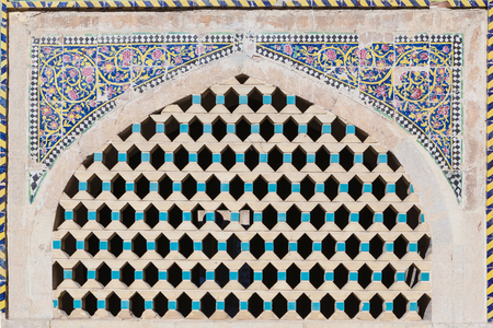Shiraz,Iran-Jan 30,2017;Beautiful old brick latticed window decorated with painting mosaic at Khan schoolのeditorial素材