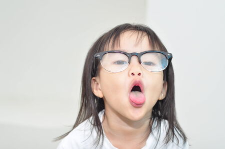 Asian little girl made funny face の写真素材
