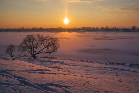Warm freeze or fozen sun. Landscape at the river's bankの写真素材