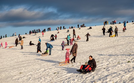 Riga, Latvia - December 4, 2016 - Snow sledding hill in Riga is joy for children and adults. This weekend first opening for public by Nil Ushakov, the mayor of the cityのeditorial素材
