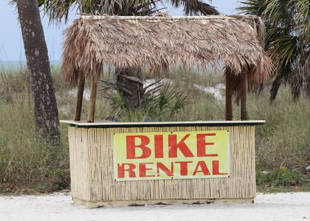 Tiki bike rental stand on a Florida beachの写真素材
