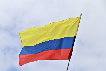 columbia flag blowing in the breeze or windの写真素材