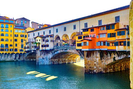 The Ponte Vecchio bride in Florence italy stretches over the arno riverの写真素材