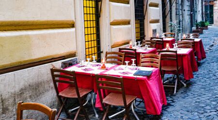 Romantic outside dining on the street in Rome, Italyの写真素材