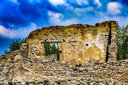 Exploring the houses and streets of the ancient city of Pompeii which is an ancient Roman city near Naples Italy that was  destroyed by  the eruption of Mount Vesuviusの写真素材