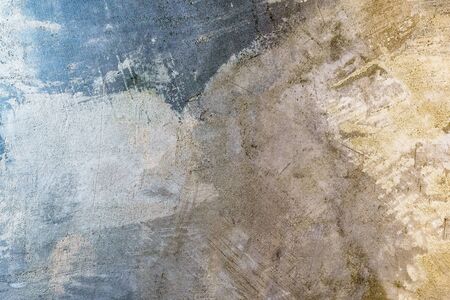 Blue, yellow background. Art rough stylized texture banner with copy space. Grungy concrete wallpaper with multi-colored lighting. の写真素材