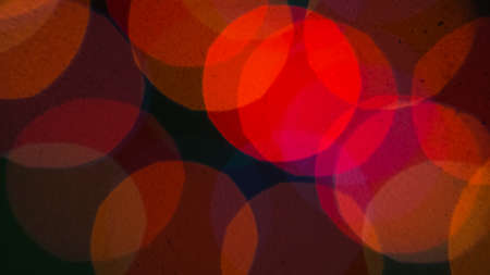 Dark background with blurred red bokeh.